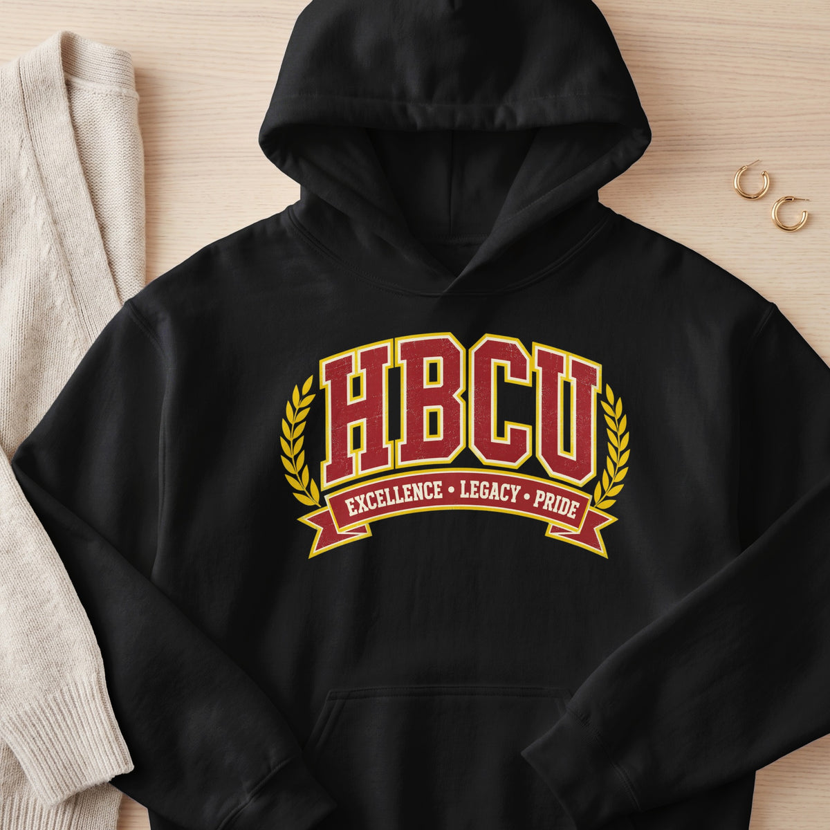 Black hoodie with "HBCU EXCELLENCE LEGACY PRIDE" text and laurel wreath.