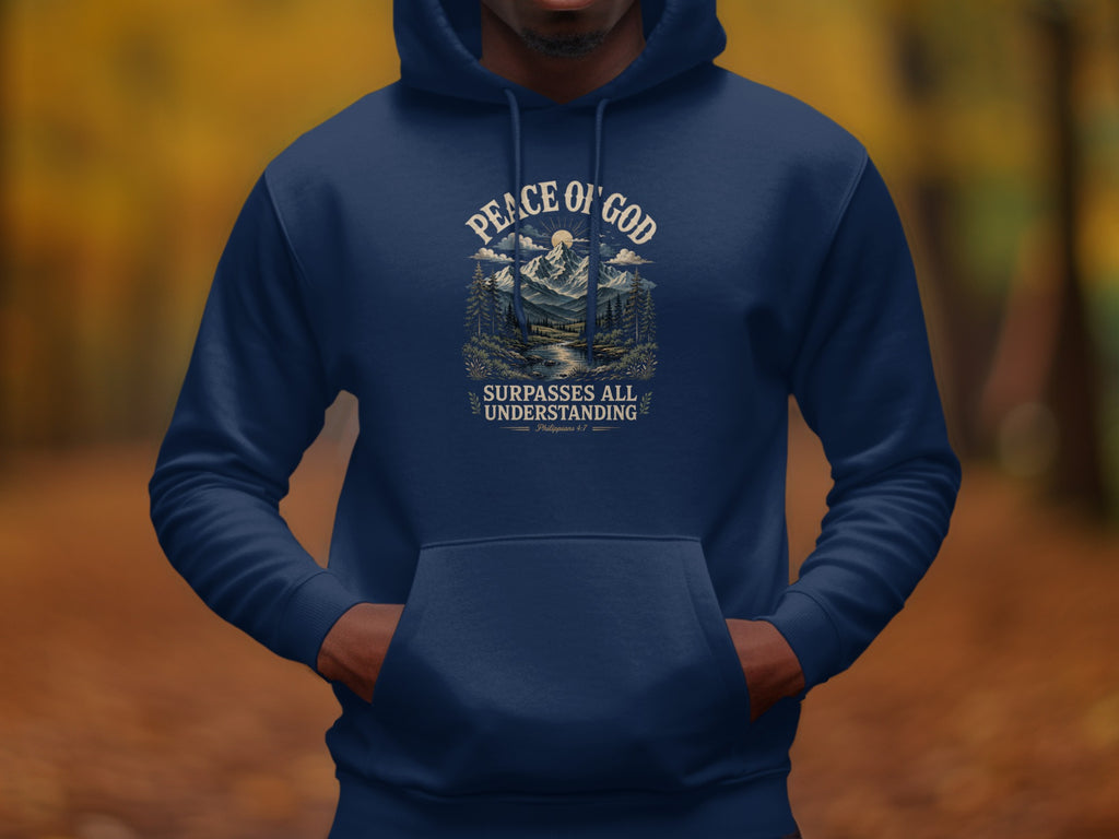 Navy hoodie with "Peace of God" landscape graphic and "Surpasses All Understanding" text.