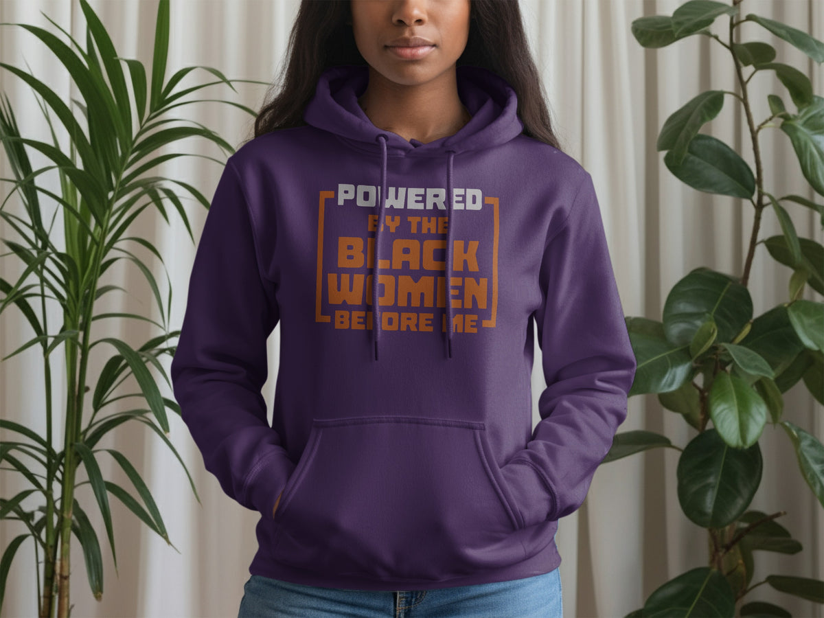 Purple hoodie with "Powered by the Black Women Before Me" text.