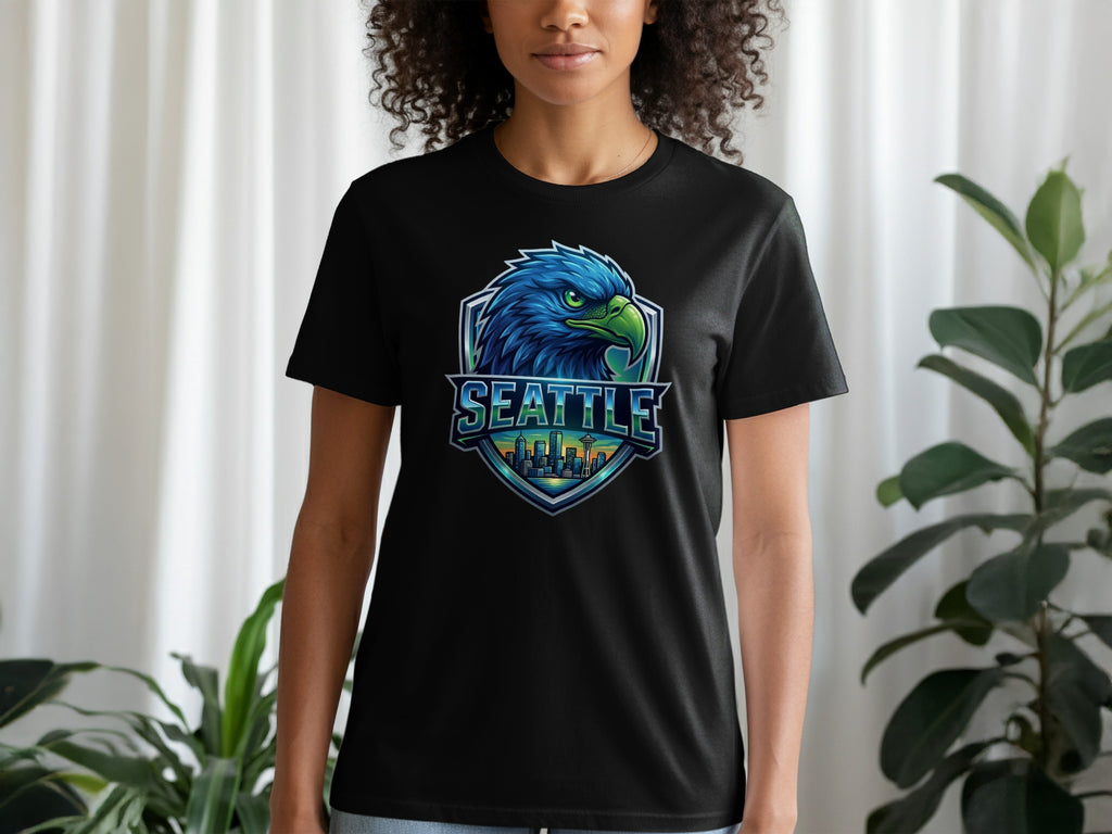 Black t-shirt with a blue eagle logo and "SEATTLE" text over a cityscape.
