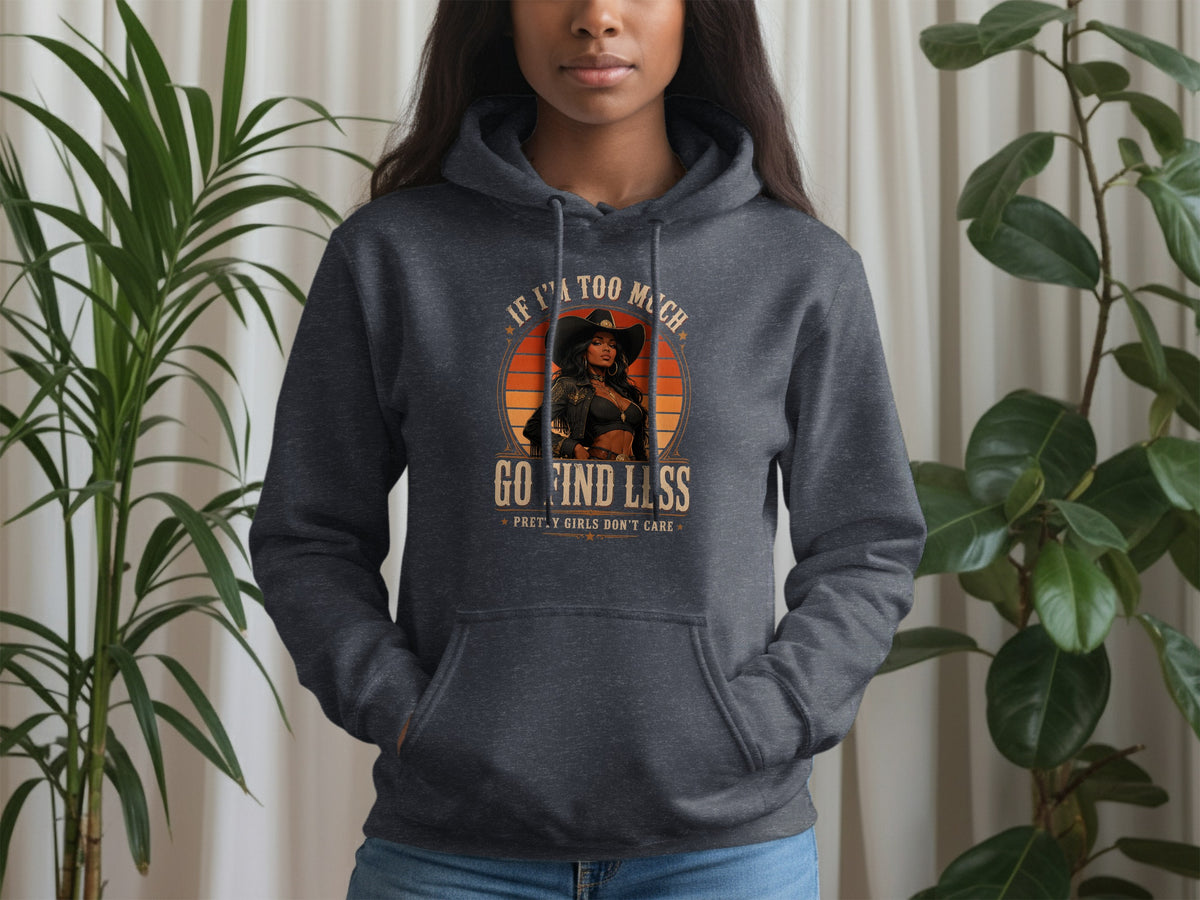 Dark grey hoodie with graphic of woman in cowboy hat and text "If I'm too much, go find less".