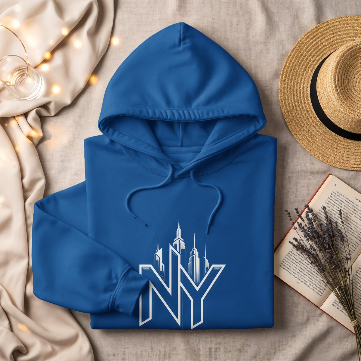 Blue hoodie with white New York skyline graphic and "NY" text.