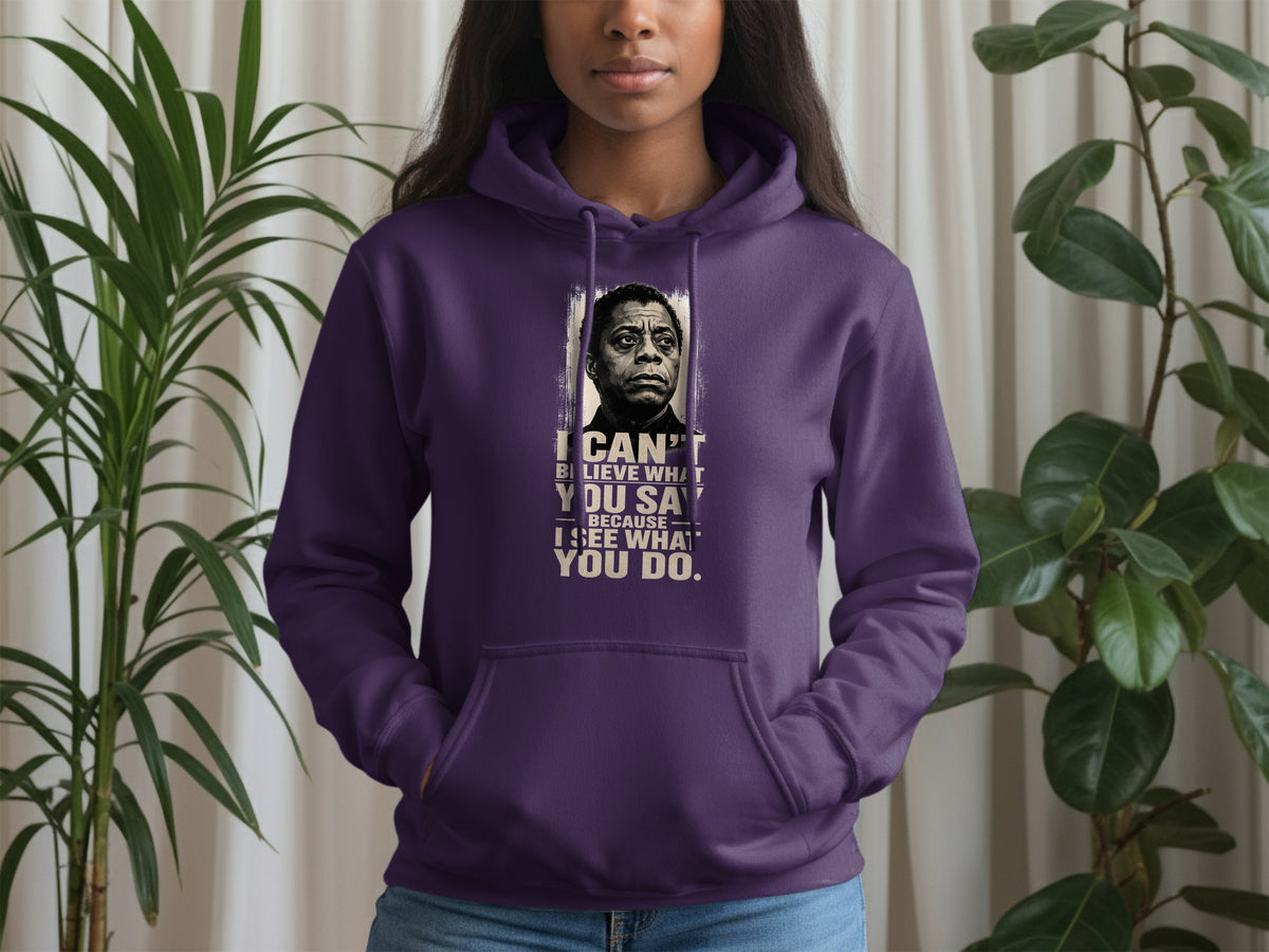 Purple hoodie with James Baldwin portrait and quote: "I can't believe what you say because I see what you do."