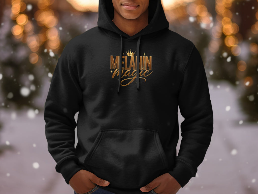 Black hoodie with gold "Melanin Magic" text and crown graphic.