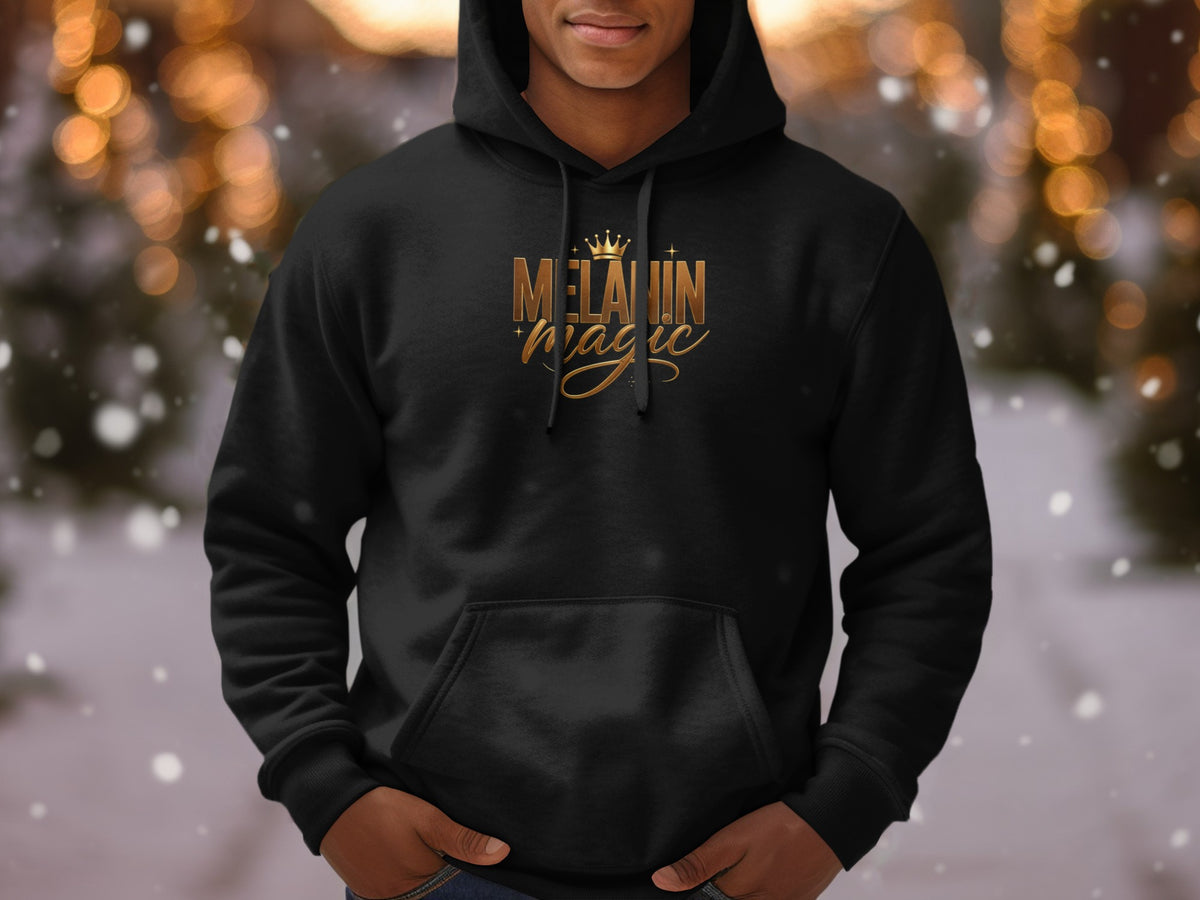 Black hoodie with gold "Melanin Magic" text and crown graphic.