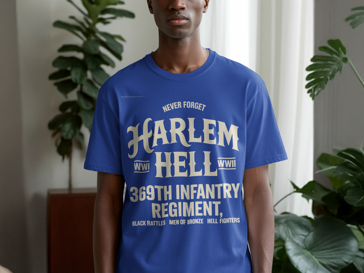Blue t-shirt with text "Never Forget Harlem Hell 369th Infantry Regiment, Black Rattles, Men of Bronze, Hell Fighters".