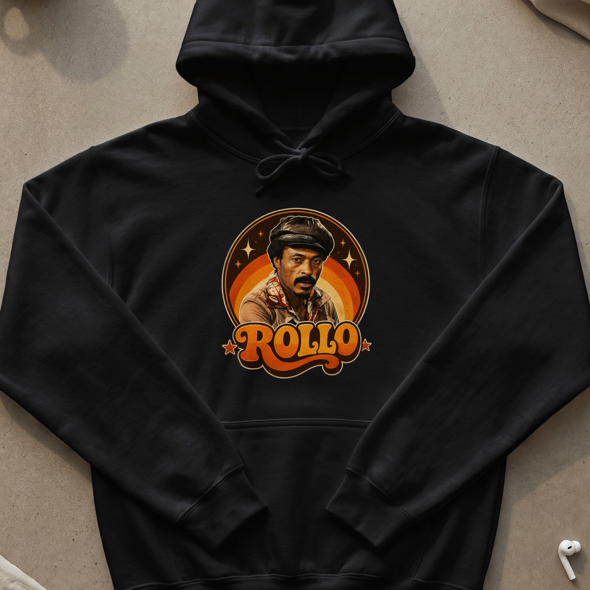 Black hoodie with a vintage graphic featuring a man and the text "ROLLO".
