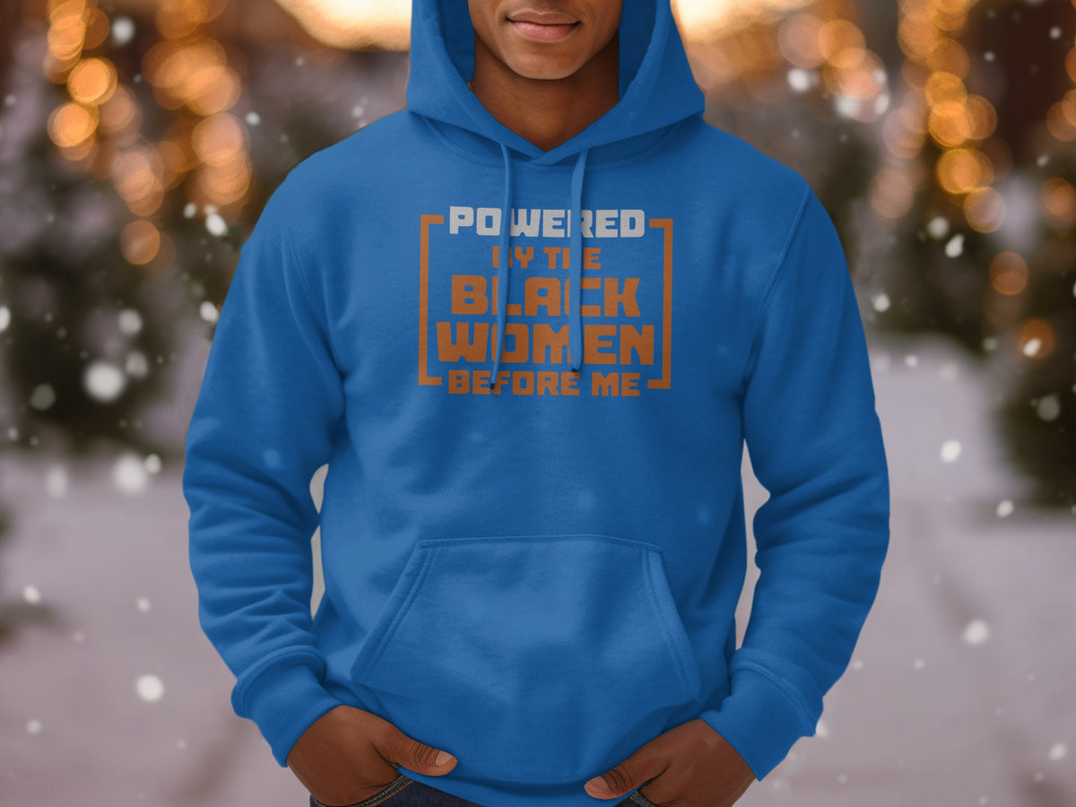 Blue hoodie with text "Powered by the Black Women Before Me" on chest