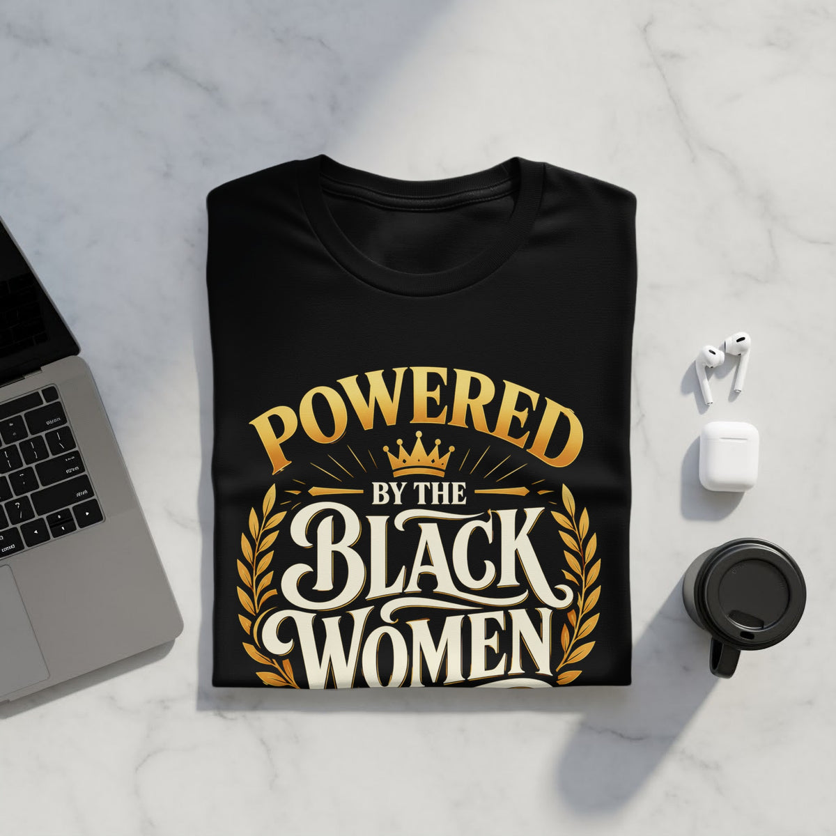 Black t-shirt with "Powered by the Black Women" text and laurel wreath design.