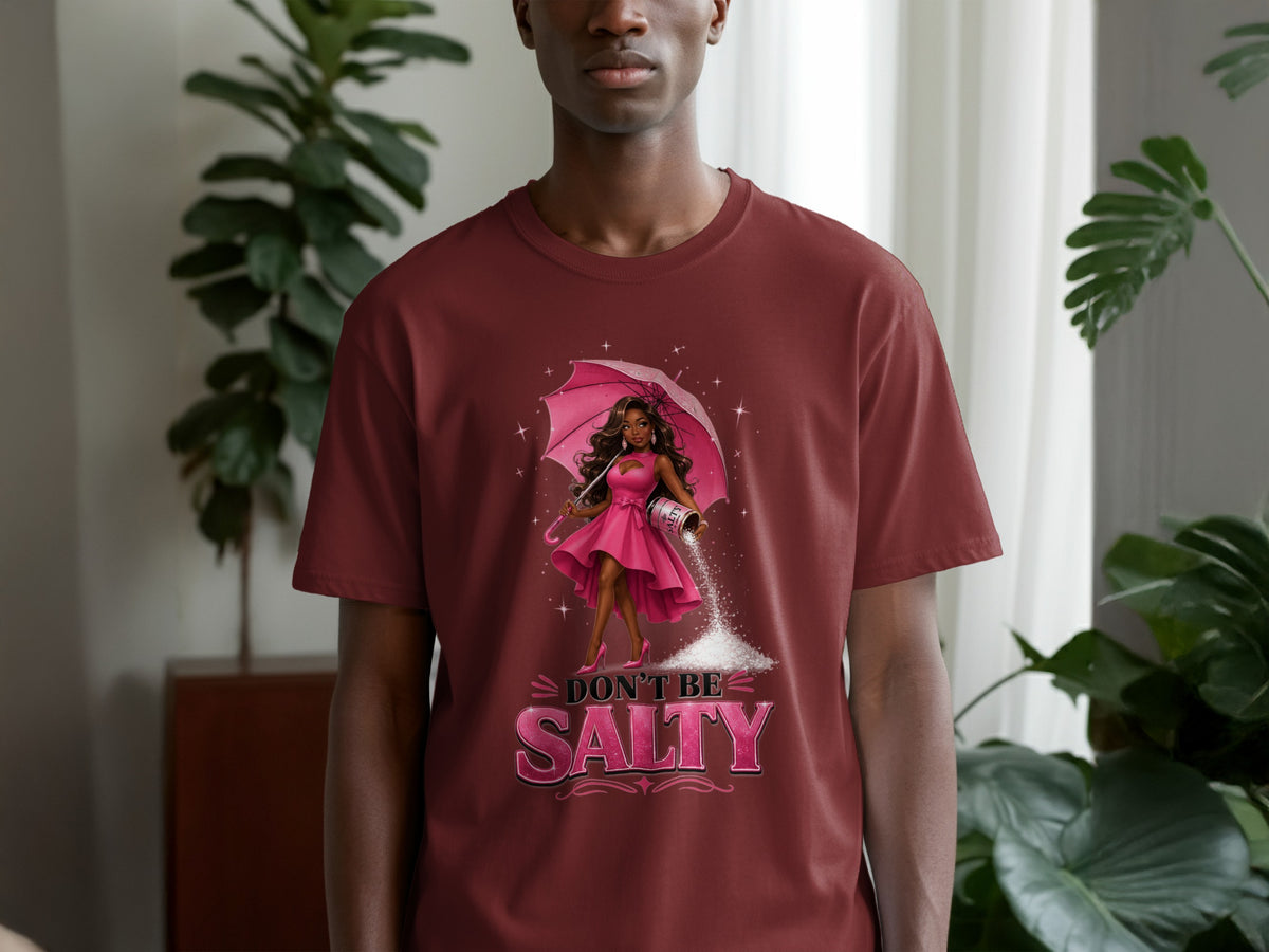T-shirt graphic of a woman holding an umbrella and pouring salt with text "Don't Be Salty".