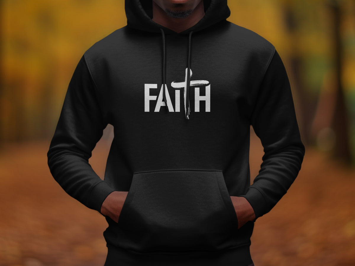 Black hoodie with white "FAITH" text and a brushstroke cross emblem.