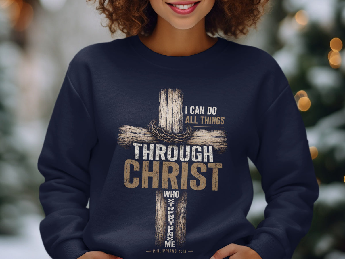 Dark navy sweatshirt with a distressed wooden cross graphic and text: "I can do all things through Christ who strengthens me - Philippians 4:13".