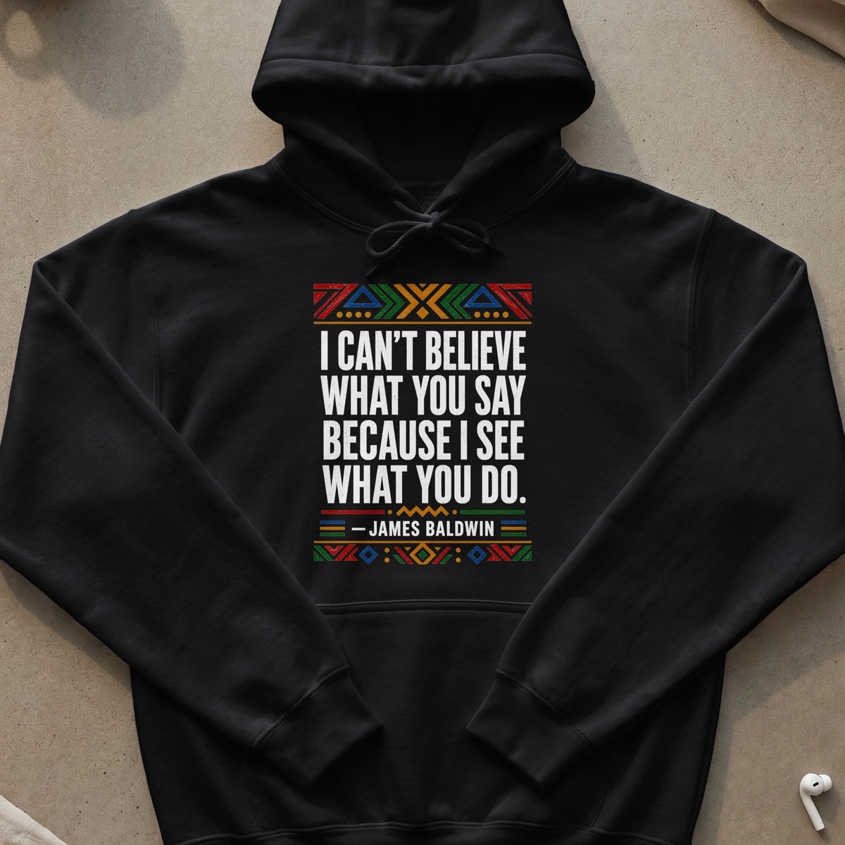 Black hoodie with James Baldwin quote and colorful geometric pattern.