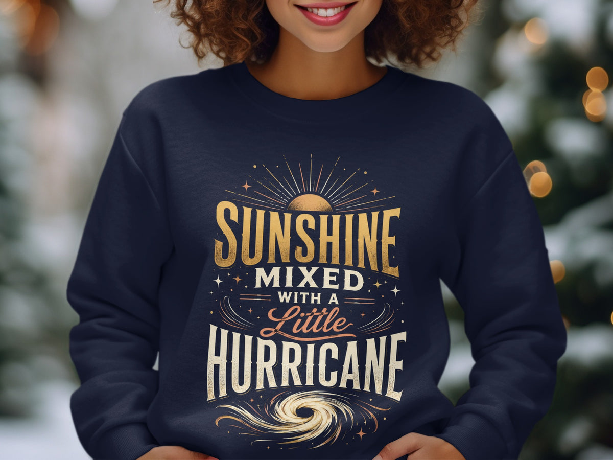 Dark blue sweatshirt with "Sunshine Mixed with a Little Hurricane" graphic.