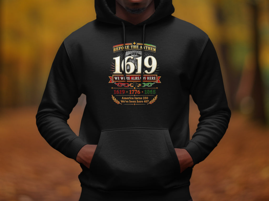 Black hoodie with "Before The Anthem 1619 We Were Already Here" text.