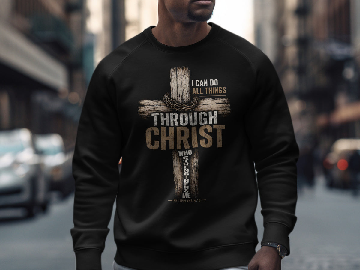 Black sweatshirt with a cross design, "I CAN DO ALL THINGS THROUGH CHRIST WHO STRENGTHENS ME" and Philippians 4:13.