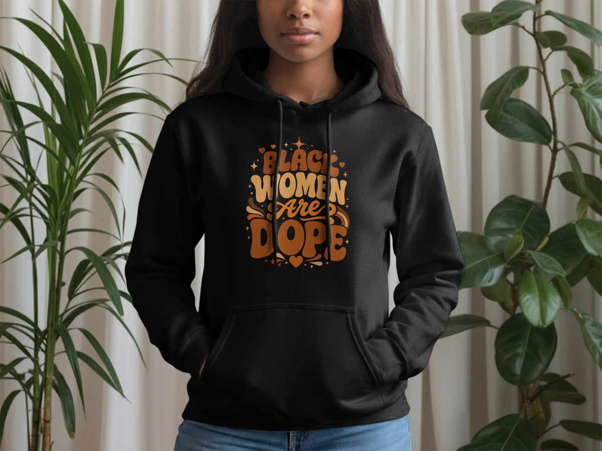 Black women are dope text on a black hoodie with decorative elements.