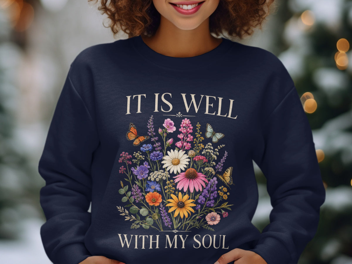 Navy sweatshirt with floral design and "IT IS WELL WITH MY SOUL" text.