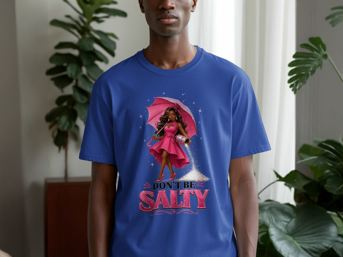Blue t-shirt with graphic of woman holding umbrella and pouring salt, text reads "DON'T BE SALTY".