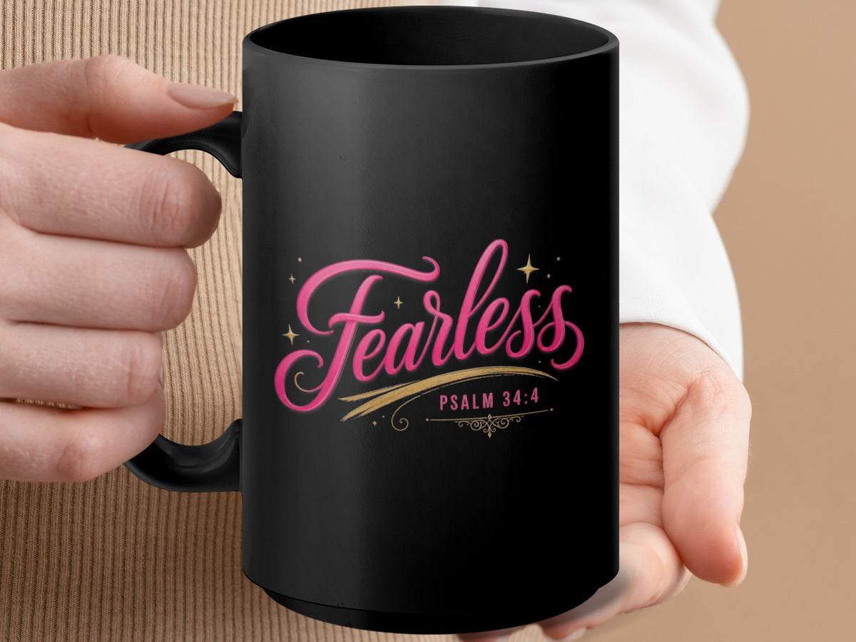 Black mug with "Fearless" and "Psalm 34:4" text in pink and gold.
