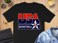 Black t-shirt with red, white, and blue "USA BASKETBALL" graphic and basketball star logo.