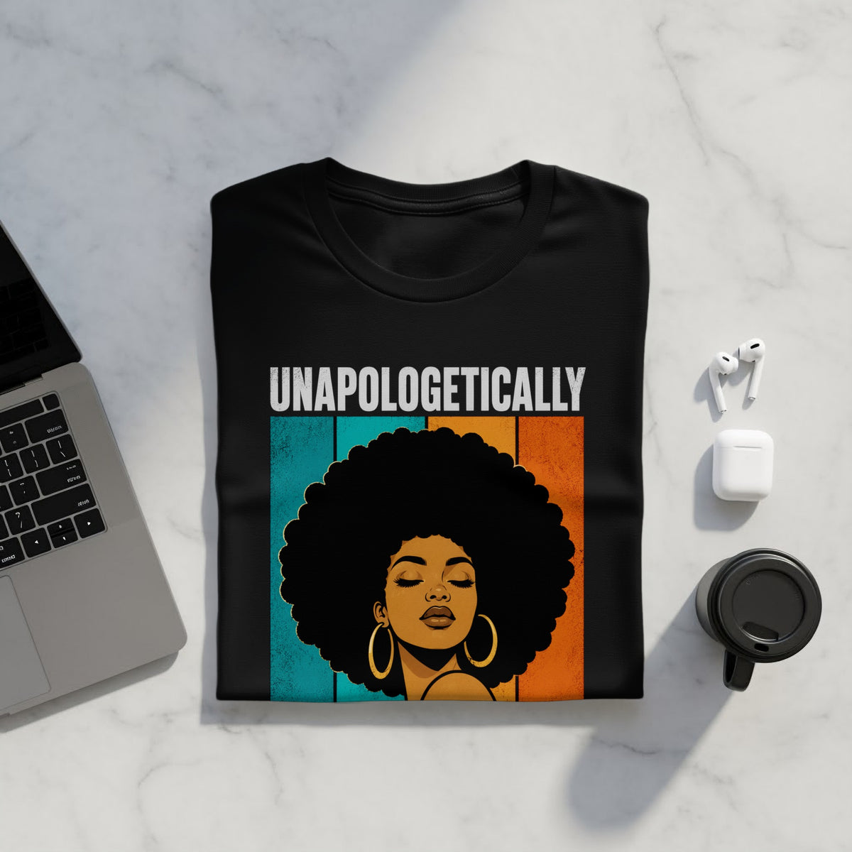 Black t-shirt with "UNAPOLOGETICALLY" text and illustration of woman with afro.