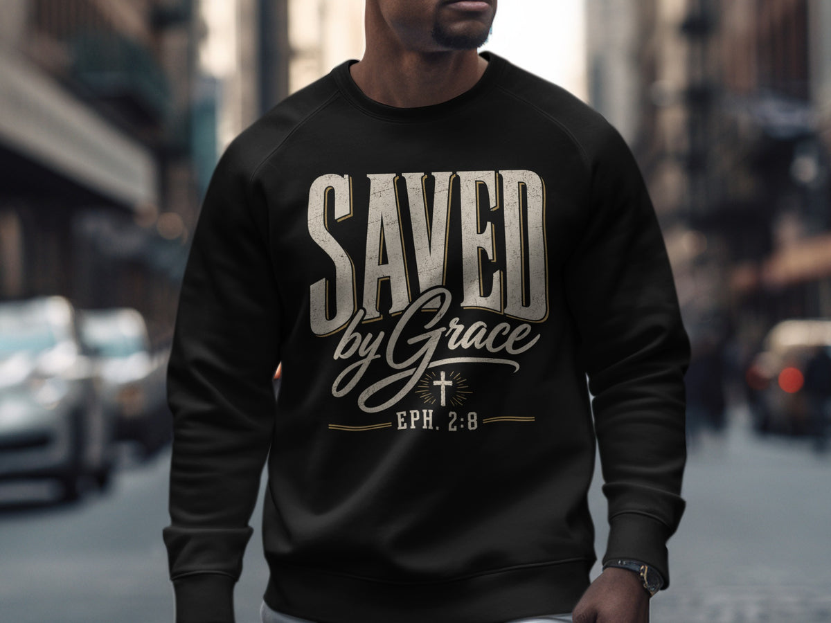 Black sweatshirt with "SAVED by Grace" and "EPH. 2:8" text and a cross design.