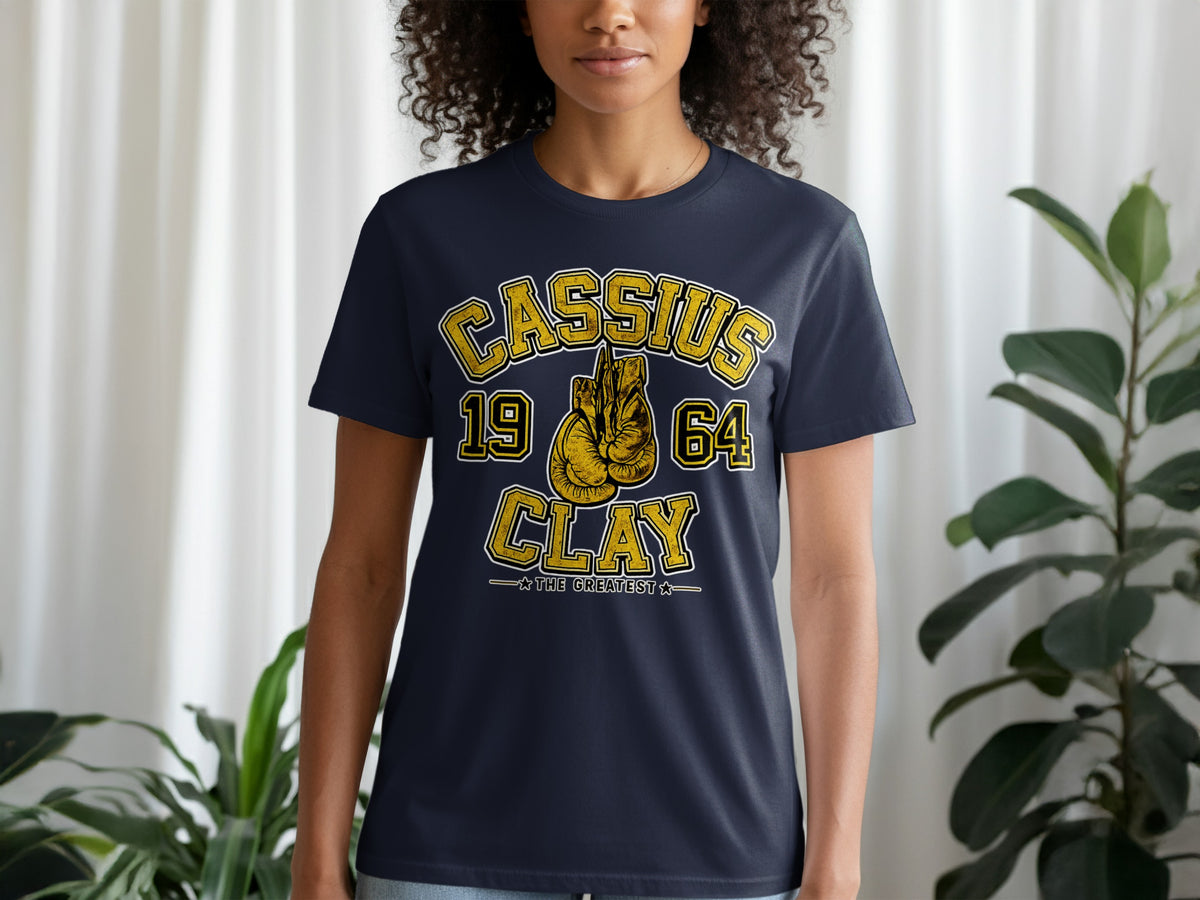 Navy t-shirt with "CASSIUS 1964 CLAY THE GREATEST" and boxing gloves graphic.