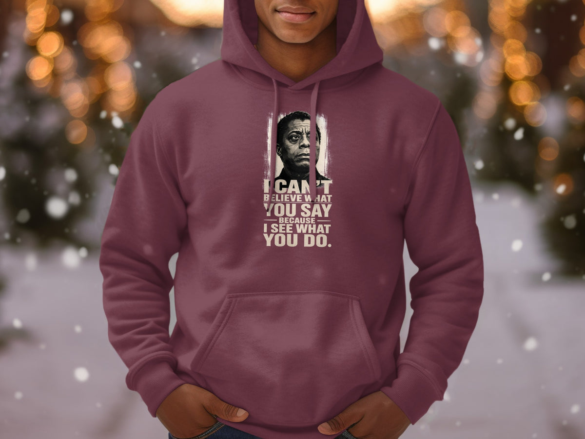 Maroon hoodie with James Baldwin portrait and quote: "I can't believe what you say because I see what you do."