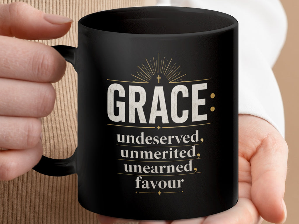 Black mug with "GRACE: undeserved, unmerited, unearned, favour" text and cross.