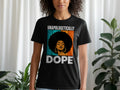 Black t-shirt with graphic of a woman with large afro and text "UNAPOLOGETICALLY DOPE".