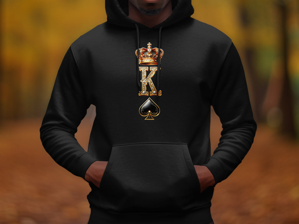 Black hoodie with golden crown, K, and spade graphic on chest.