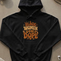 Black Women Are Dope text on a black hoodie with heart and star accents.