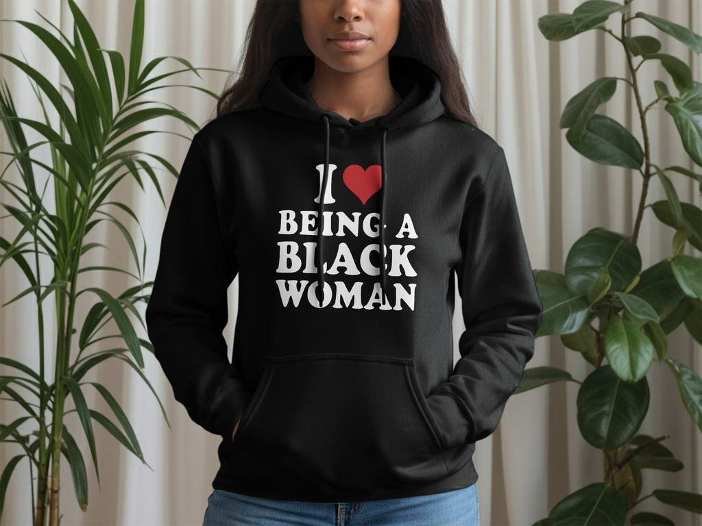 Black hoodie with white text that reads "I ♡ BEING A BLACK WOMAN".