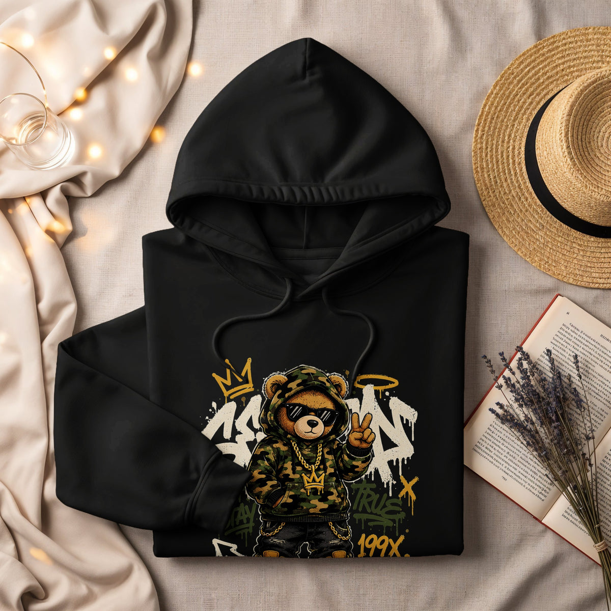Black hoodie with a graphic of a hip-hop teddy bear wearing sunglasses and gold chains.