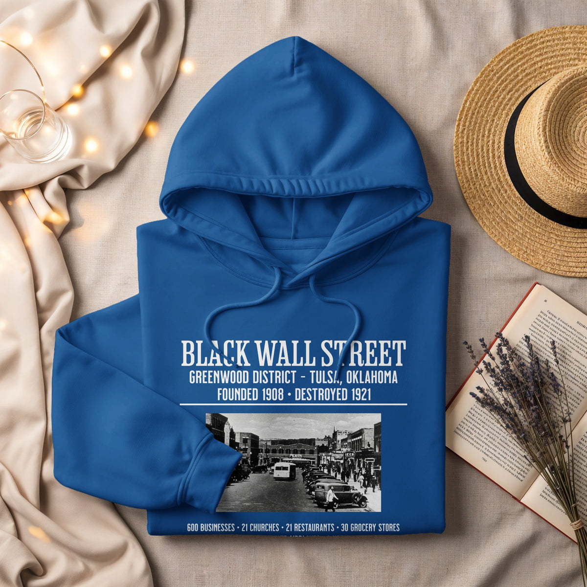 Blue hoodie with "Black Wall Street" text and historical Tulsa image.