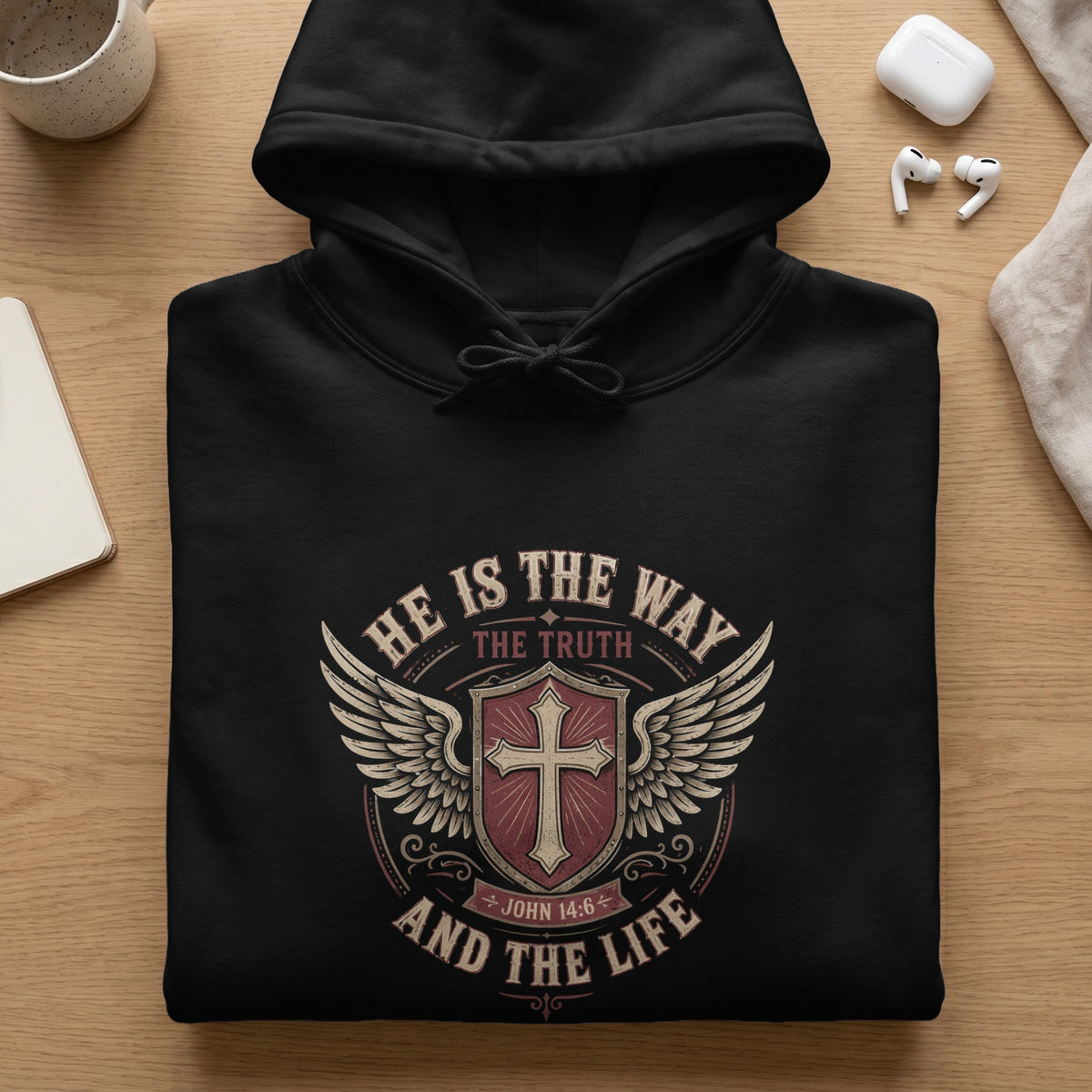 Black hoodie with "He Is The Way, The Truth, And The Life" and John 14:6.