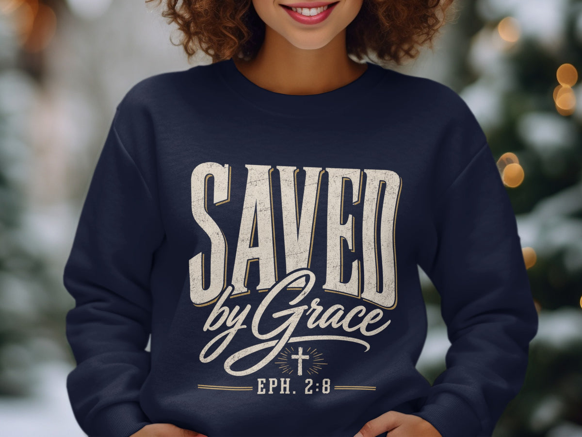 Navy sweatshirt with "Saved by Grace" text and "Eph. 2:8" scripture reference.