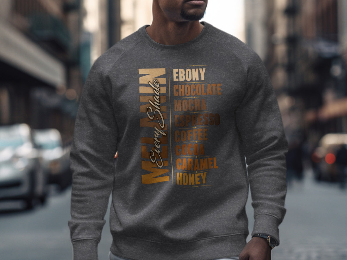 Man of Every Shade text on grey sweatshirt, listing shades like Ebony, Chocolate, Mocha.