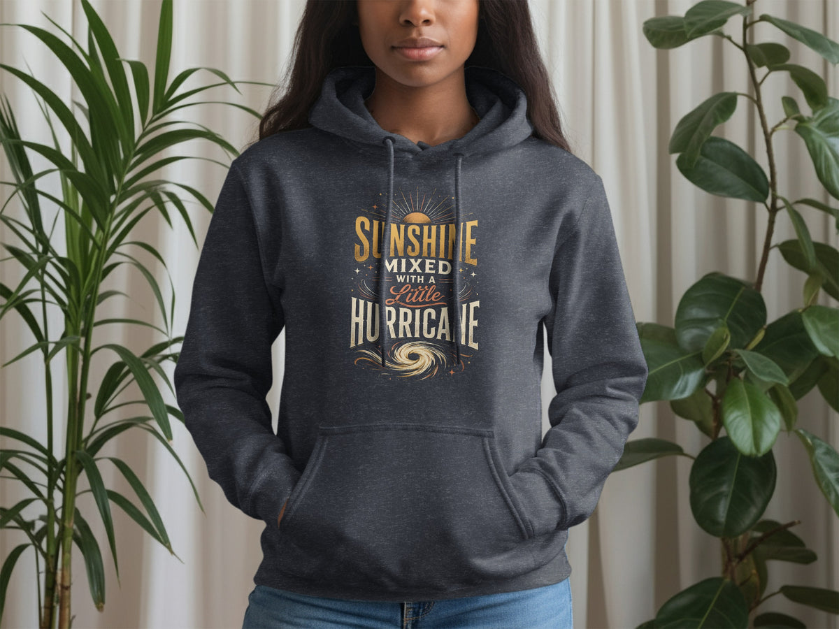 Dark grey hoodie with gold text reading "Sunshine mixed with a little hurricane".