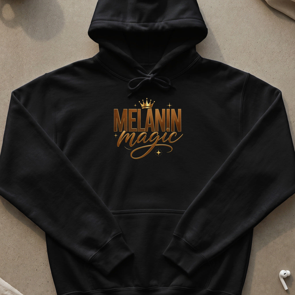 Black hoodie with gold text and crown graphic reading "Melanin Magic"