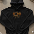 Black hoodie with gold text and crown graphic reading "Melanin Magic"