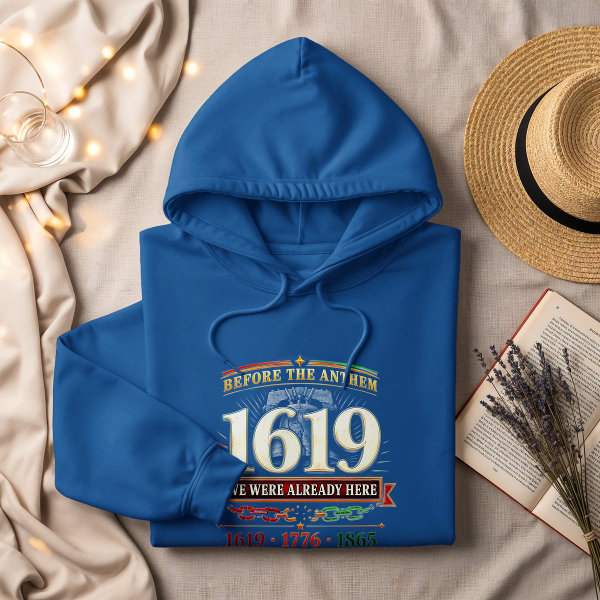 Blue hoodie with 1619 text and "Before The Anthem We Were Already Here" graphic.