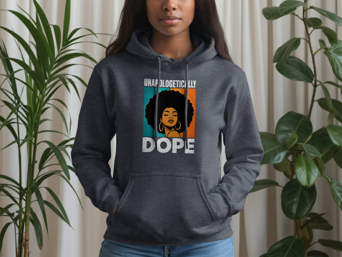 Dark gray hoodie with a graphic of a woman's face and text "UNAPOLOGETICALLY DOPE".