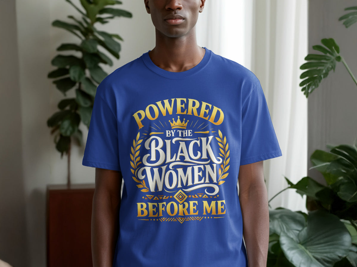 Blue t-shirt with "Powered by the Black Women Before Me" text and gold laurel accents.