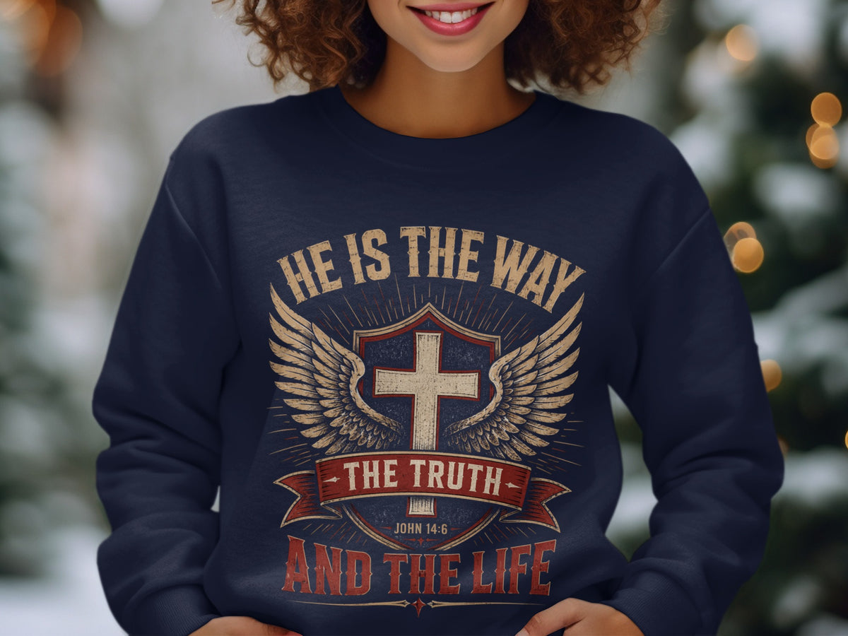 Navy sweatshirt with "HE IS THE WAY THE TRUTH AND THE LIFE" text and religious symbols.