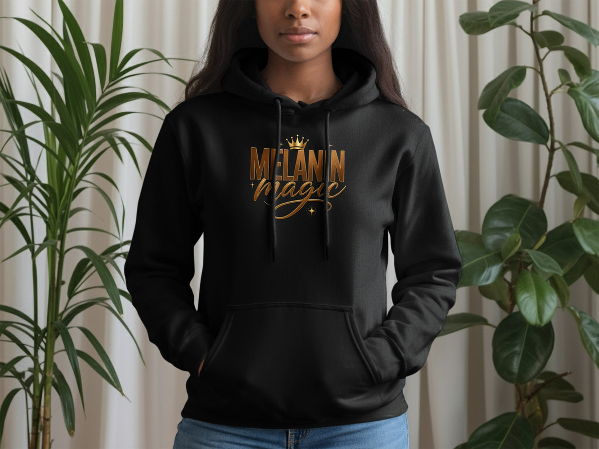 Black hoodie with gold "Melanin Magic" text and crown graphic.