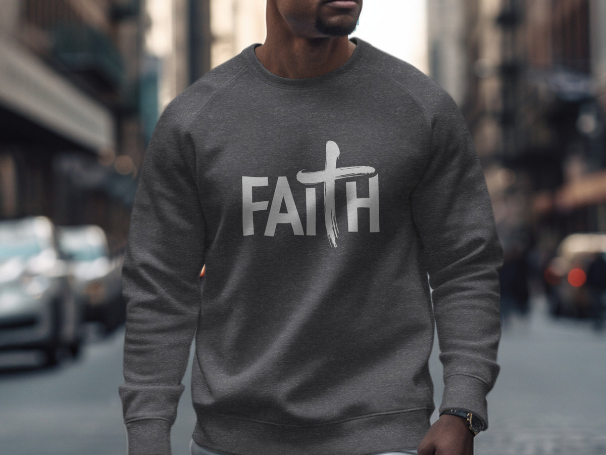 Dark grey sweatshirt with white "FAITH" text and a brushstroke cross.