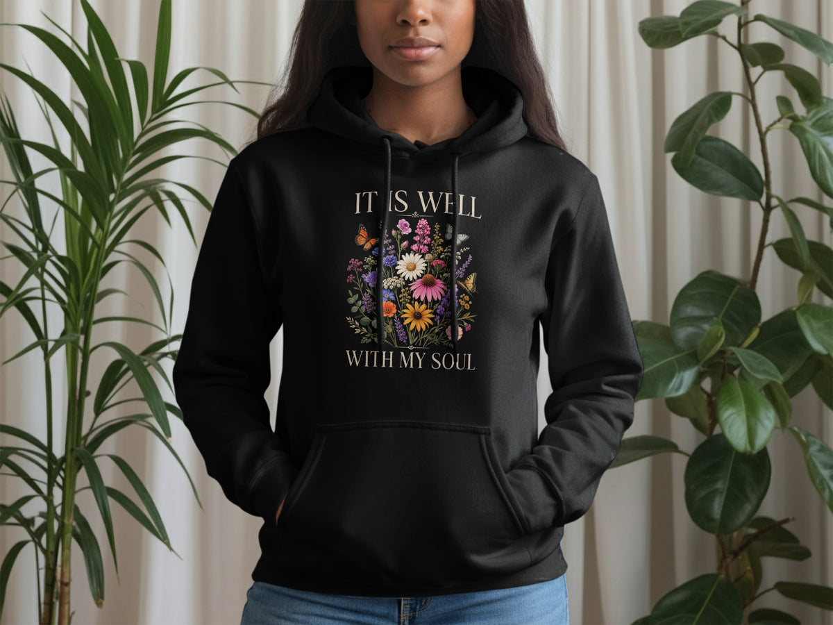 Black hoodie with "It is well with my soul" text and floral design.