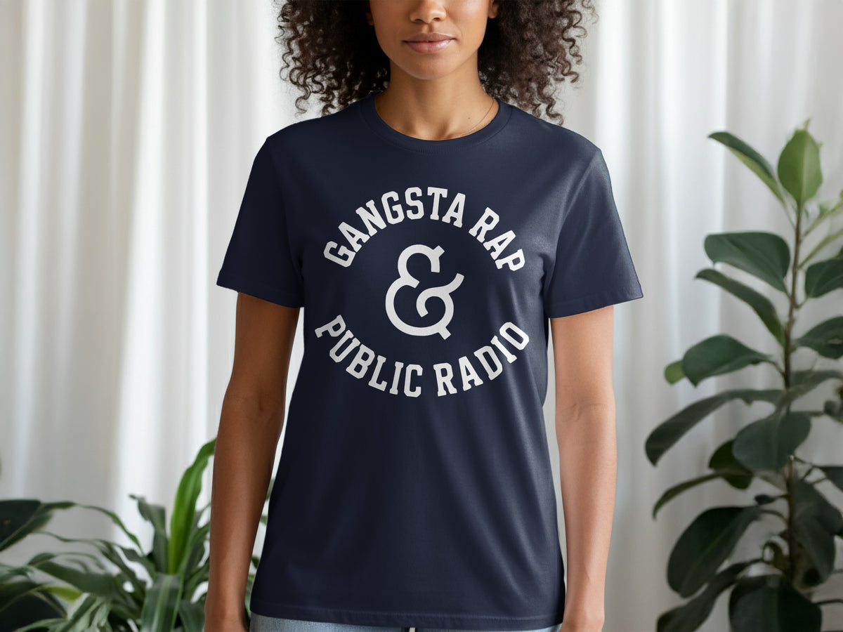 Dark navy t-shirt with white text "Gangsta Rap & Public Radio" in a circular design.